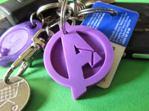 Keyring of a purple Avengers logo.